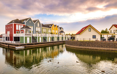 Obraz premium Dutch, modern, colorful vinex architecture style houses at waterside