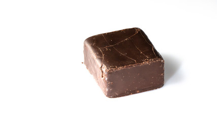 Square candy cane with cracks on the surface, on a white background