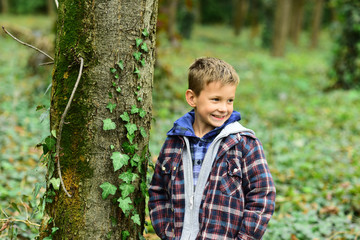 True happiness is ti enjoy the present. Happy small boy. Small boy enjoy free time in park. Happiness is freedom