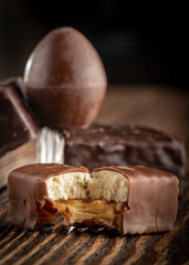 Chocolate candies on a wooden background. Close-up