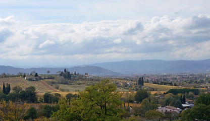 Fototapeta na wymiar Tuscany, Italy, November 2018, landscape of countryside near Arezzo with the city on the background, on a sunny day