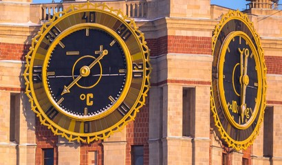 Giant thermometer and atmospheric pressure indicators onto a tower of famous Russian unversity