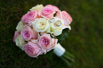 wedding bouquet with roses and rings
