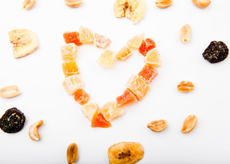 Dried fruits nuts Heart symbol white background 