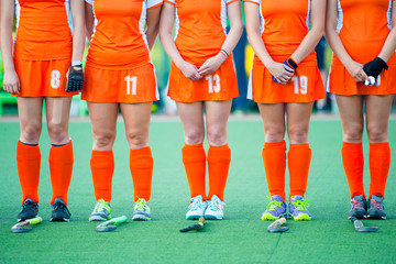 Field hockey team on the green grass