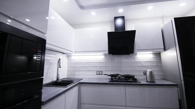 interior of modern tech kitchen white. LED lighting furniture