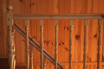 row of wooden column wooden stairs in wooden house 