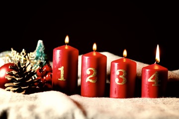 Fourth Sunday (week) of Advent - four Advent candles (with four burning) and Christmas decoration