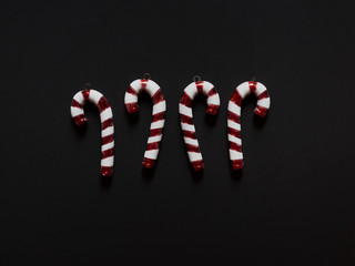 Christmas candy cane drums  at studio above view over a black background isolated flatlay