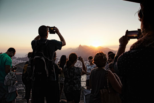 People take photos from Morro da Urca on the Sugarloaf cable car line