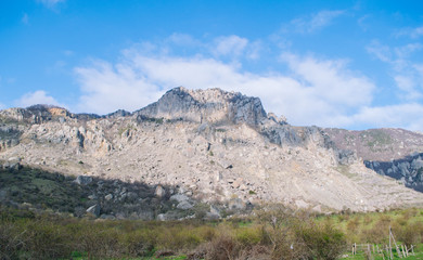Rocks, bushes and fog in autumn Crimea mountains. Beautiful landscape.