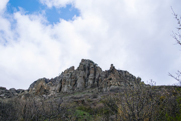 Rocks, bushes and fog in autumn Crimea mountains. Beautiful landscape.