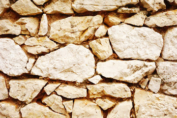 Masonry stone wall, rock wall made with cement