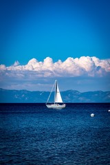 Sailboat on lake with clouds