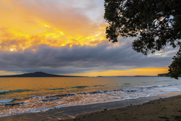 Landscape Scenery during Sunrise Time at Takapuna Beach, Auckland New Zealand; View to Rangitoto Island