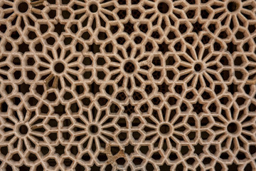Texture of stone grating at Red Fort in Agra, India