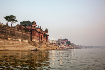 Varanasi, Uttar Pradesh, India. A view from River Ganges of Old Historical Varanasi city with weathered buildings at the time of Sunrise