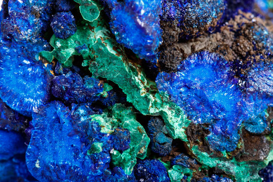 Macro mineral stone malachite with azurite on white background