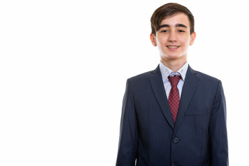 Studio shot of young happy Persian teenage businessman smiling