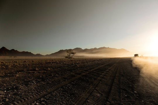 Endless empty dirt road in Namib desert of Namib-Naukluft National Park, Namibia, Africa