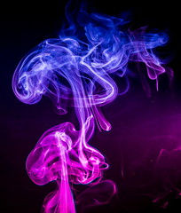 Obraz premium Colored smoke on black background