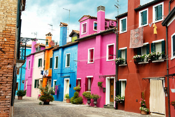 Fototapeta na wymiar Beautiful street with multicolored houses, Burano island, Venice, Italy