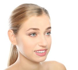 Portrait of young woman with beautiful natural eyelashes on white background