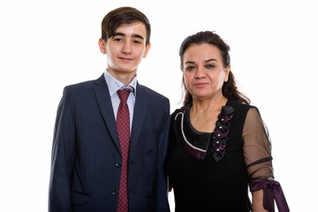 Studio shot of young Persian teenage businessman and mature Pers