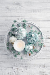 Tray with christmas decorations and candle