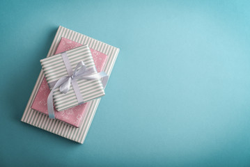 Several gift striped boxes with grey ribbon