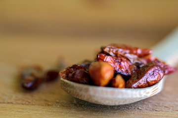 Dried red chili on wooden board