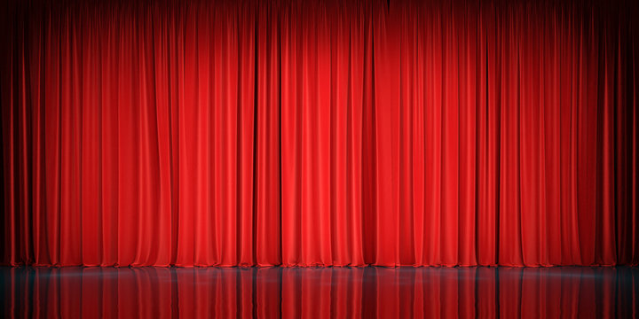 Theater stage with red velvet curtains. 