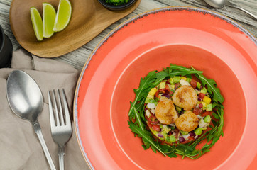 Scallop ceviche. Delicious ceviche of scallop, fish with fresh vegetables, spices and lime  