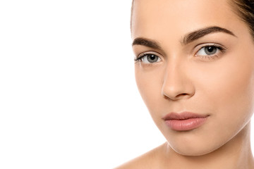 Obraz premium Portrait of beautiful young woman on white background. Lips contouring, skin care and cosmetic surgery concept