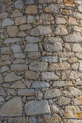 Detailed texture of masonry wall in granite stones