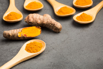 Fresh organic root and turmeric powder - Curcuma longa.