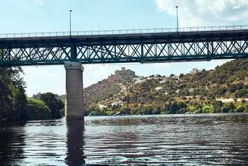 bridge over river with background castle