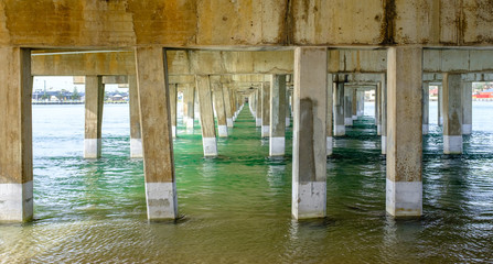Under the bridge, receding to infinity the pillars under Windang Bridge, Lake Illawarra, NSW, Australia