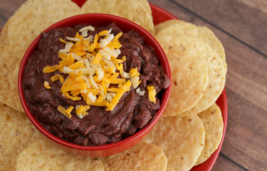 Bowl of Black Bean Dip on a Wooden Table