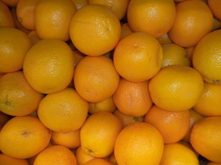 a bunch of fresh ripe oranges