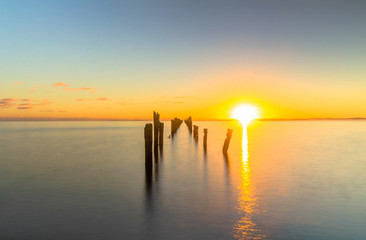 sun and a pier