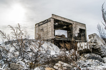 Old destroyed an abandoned multi-storey building in a military t