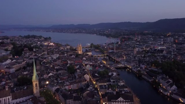 twilight illuminated zurich city center riverside aerial panorama 4k switzerland
