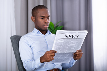 Man Reading Newspaper