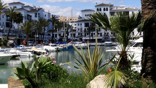 Spanish Marina in Puerto de La Duquesa in The Costa del Sol in Spain.
Camera = Static shot through trees.