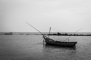 Black and white of Fishing boat on the beach