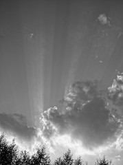 bright rays of the sun from behind the clouds