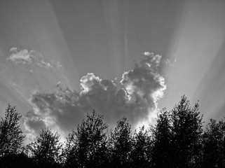 bright rays of the sun from behind the clouds