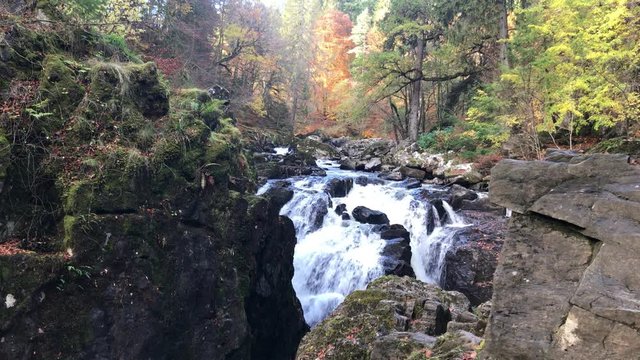 Rapid Cascade on a River in the Highlands in Scottish mountains Scotland travel Concept with autumn landscape fall tourism in Scottish rivers