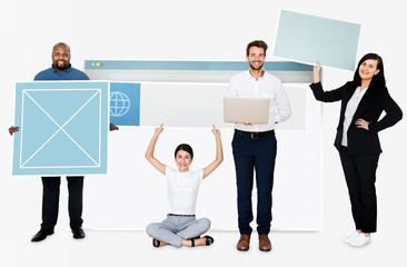 Happy diverse people holding wed design board